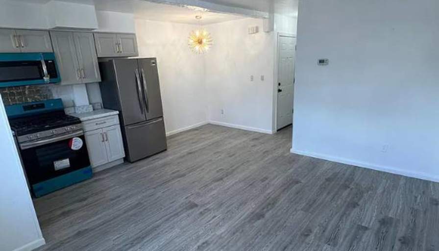 Updated kitchen with modern appliances's room
