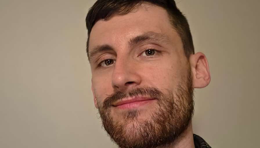 Adam J Sarauer