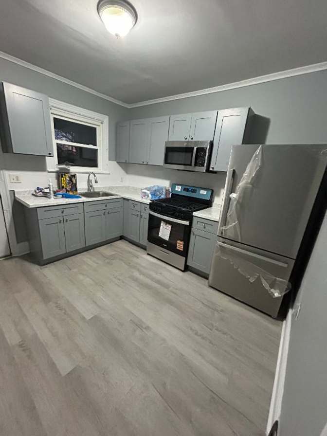 modern kitchen with all new cabinets's room