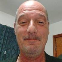 John E Ouge